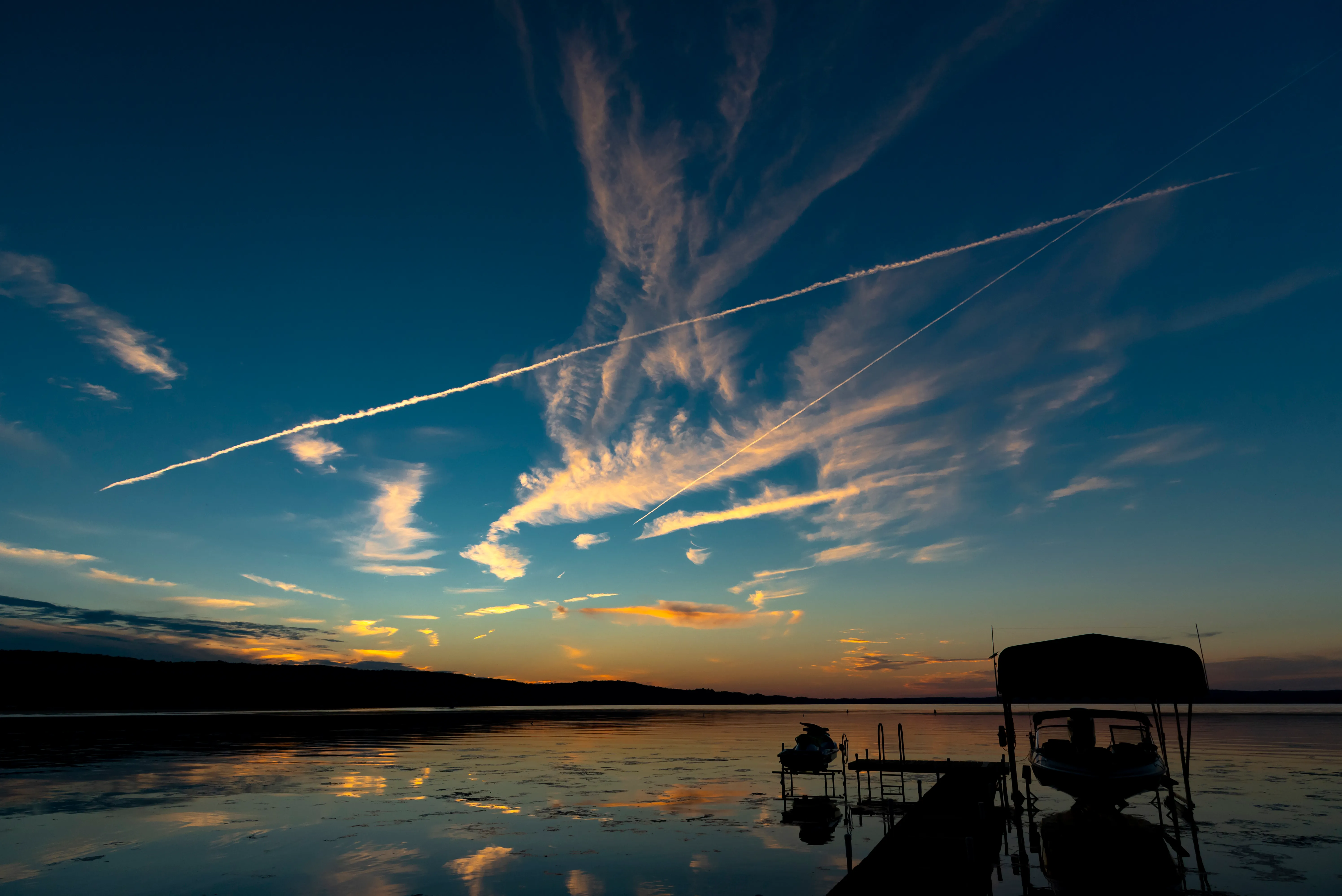 Chautauqua Lake at sunset, New York—pink and gold sky on the water; scenic photo used on Heidi Brooks Chautauqua Lake real estate